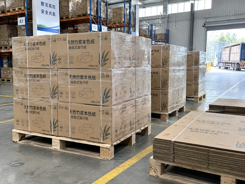 Cartons and flat blanks arranged on pallets in the warehouse.
